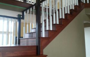 Wooden staircase with white rails
