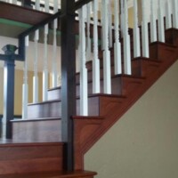 Wooden staircase with white rails
